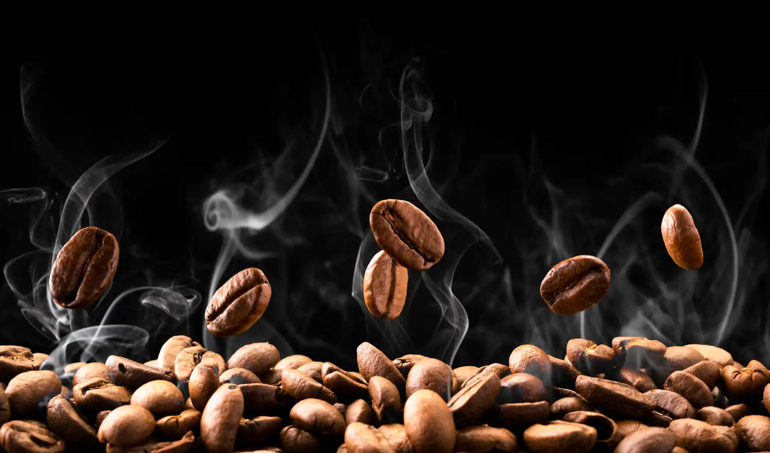 Coffee beans with rising steam against a dark backdrop.